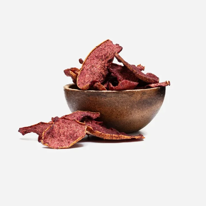 Szárított almaszeletek áfonyaporral 